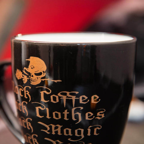 Close up design of the Alchemy Black Coffee, Black Clothes Coffee Mug