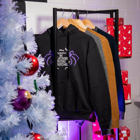 The Nightmare Before Christmas Moonlight Hoodie on Clothes Rack with Christmas Tree