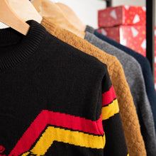Load image into Gallery viewer, Harry Potter Gryffindor Crest Knitted Christmas Jumper with other clothing on rack