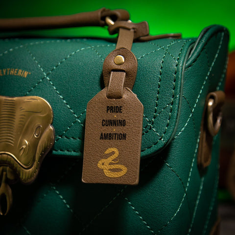 Branded Tag displaying 'Pride, Cunning, Ambition' attached to Slytherin Trunk Bag